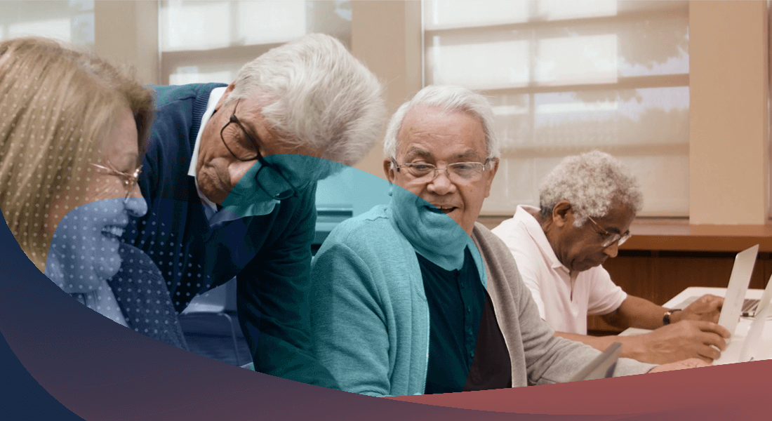Elderly man looking at his computer